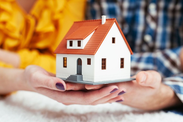 Hispanic Couple Viewing Potential New Home