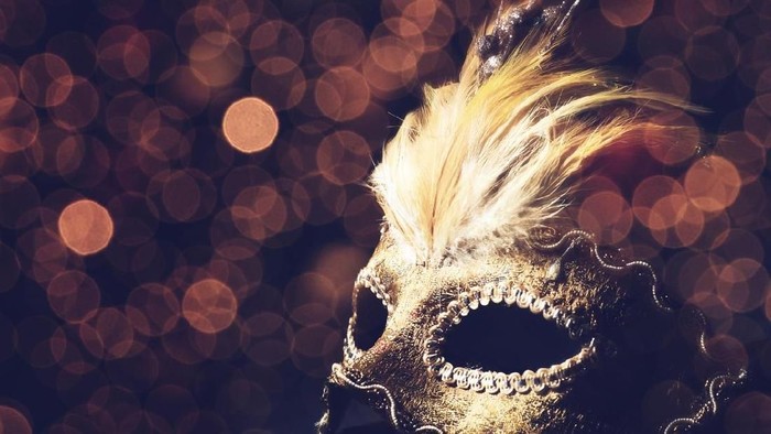 Blindfolded woman with red lip on black background