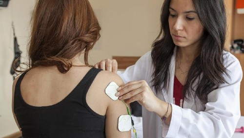 Patient at the physical therapy session in an exam room
