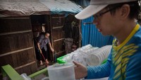 GUANGZHOU, CHINA - JUNE 20:  Chinese Phd student and researcher Zhang Dongjing displays a container of sterile adult male mosquitos that are ready to be released in a lab in the Mass Production Facility at the Sun Yat-Sen University-Michigan University Joint Center of Vector Control for Tropical Disease on June 20, 2016 in Guangzhou, China. Considered the worlds largest mosquito factory, the laboratory raises millions of male mosquitos for research that could prove key to the race to prevent the spread of Zika virus. The labs mosquitos are infected with a strain of Wolbachia pipientis, a common bacterium shown to inhibit Zika and related viruses including dengue fever.Â Researchers release the infected mosquitos at nearby Shazai island to mate with wild females who then inherit the Wolbachia bacterium which prevents the proper fertilization of her eggs. The results so far are hopeful:Â  After a year of research and field trials on the island, the lab claims there is 99% suppression of the population of Aedes albopictus or Asia tiger mosquito, the type known to carry Zika virus. Researchers believe if their method proves successful, it could be applied on a wider scale to eradicate virus-carrying mosquitos in Zika-affected areas around the world. Â The project is an international non-profit collaboration lead by Professor Xi Zhiyong, director of the Sun Yat-Sen University-Michigan University Joint Center of Vector Control for Tropical Disease with support from various levels of Chinas government and other organizations.Â   (Photo by Kevin Frayer/Getty Images)