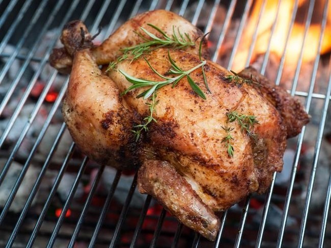 ayam panggang grilled chicken leg on the grill