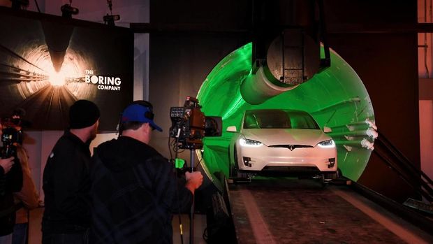 Elon Musk, co-founder and chief executive officer of Tesla Inc., arrives in a modified Tesla Model X electric vehicle during an unveiling event for the Boring Co. Hawthorne test tunnel in Hawthorne, California, U.S., December 18, 2018.  Robyn Beck/Pool via REUTERS