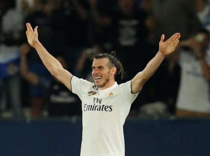 Soccer Football - Club World Cup - Semi-Final - Kashima Antlers v Real Madrid - Zayed Sports City Stadium, Abu Dhabi, United Arab Emirates - December 19, 2018  Real Madrid's Gareth Bale celebrates scoring their third goal   REUTERS/Andrew Boyers