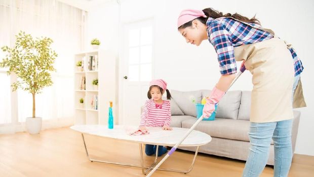 mum teaching daughter cleaning home