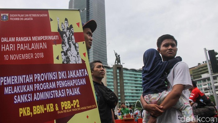Badan Pajak dan Retribusi Daerah DKI menggelar penghapusan sanksi administrasi pajak di CFD, Jakarta. Minggu (23/12/2018).