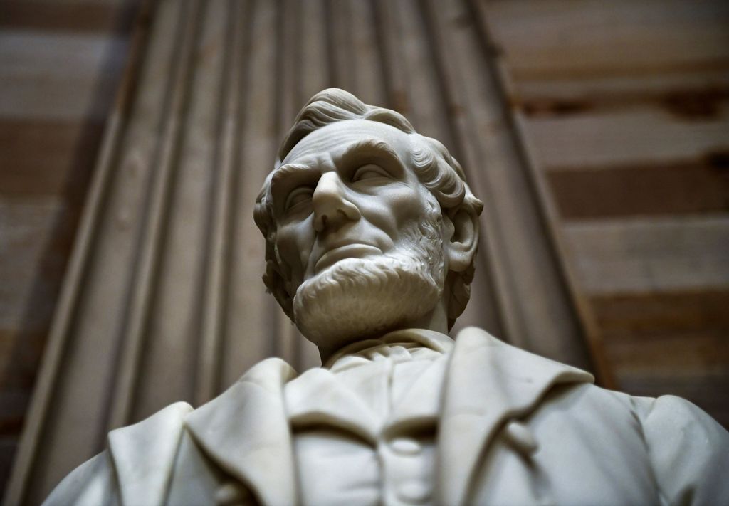 A statue of former U.S. President Abraham Lincoln stands inside the U.S. Capitol rotunda in Washington, D.C., U.S., December 3, 2018. Brendan Smialowski/Pool via REUTERS