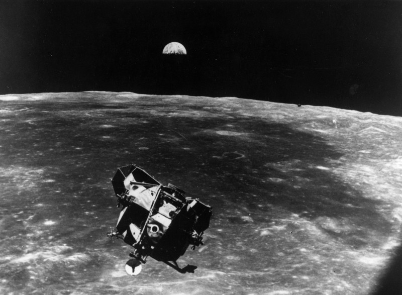 The Apollo 11 space module floating above the Moon. The Earth can be seen rising behind.    (Photo by Keystone/Getty Images)