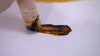 Tar hitam pekat diambil dari selang kubah yang menghisap rokok konvensional. (Foto: BBC/NHS Smokefree)