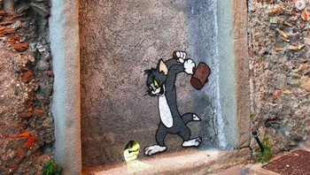 Lucu! Tom yang siap memukul Jerry. (Foto: Brightside)