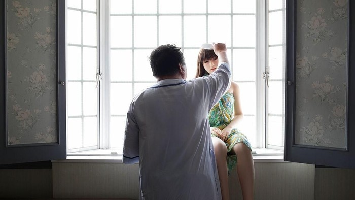 TOKYO, JAPAN - JUNE 25:  Senji Nakajima watches TV with his Love Doll Saori at his apartment on June 25, 2016 in Tokyo, Japan. Senji Nakajima, 61 years old, lives with his life-size love doll named Saori in his apartment in Tokyo, Japan. Nakajima, married with two children, who lives away from home for work, first started his life with Saori six years ago. At first, he used to imagine as if the doll was his first girl friend, and used it only for sexual purposes to fill the loneliness, but months later, he started to find Saori actually has an original personality. She never betrays, not after only money. Im tired of modern rational humans. They are heartless, Nakajima says, for me, she is more than a doll. Not just a silicon rubber. She needs much help, but still is my perfect partner who shares precious moments with me and enriches my life.  (Photo by Taro Karibe/Getty Images)