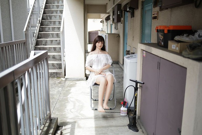 TOKYO, JAPAN - JUNE 25:  Senji Nakajima watches TV with his Love Doll 