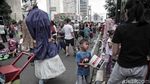 Potret Miris Anak-anak Pengamen Ondel-ondel di Ibu Kota
