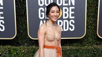 Ia terlihat cantik menawan dengan dress semi transparan berwarna nude itu. Frazer Harrison/Getty Images