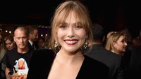 Elizabeth mengenakan gaun Alexandre Vauthier, sepatu Christian Louboutin, dan anting-anting Beladora. Foto: (Jon Kopaloff/Getty Images)