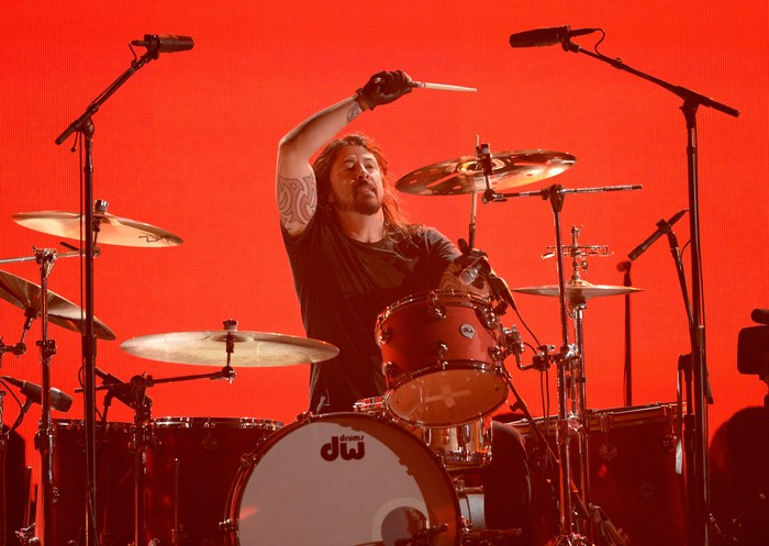 LOS ANGELES, CA - JANUARY 26:  Musician Dave Grohl performs with Queens of the Stone Age onstage during the 56th GRAMMY Awards at Staples Center on January 26, 2014 in Los Angeles, California.  (Photo by Kevork Djansezian/Getty Images)
