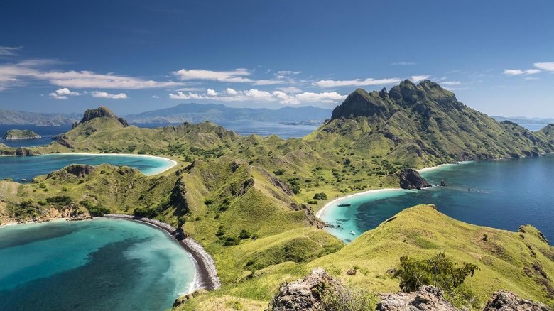Aerial view of the island Pulau Padar at the famous Komodo National Park in Indonesia. Komodo is world wide famous for the beautiful underwater life, the diving sites and the Komodo dragon. Secluded white sand beaches also spot the islands of the archipelago.