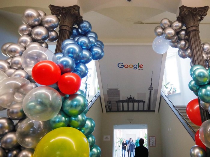 Workers move a Google logo during the opening of the new Alphabets Google Berlin office in Berlin, Germany, January 22, 2019. REUTERS/Hannibal Hanschke