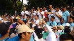 Potret Kampanye Akhir Pekan: Prabowo Jalan Sehat, Jokowi Sambut Dukungan