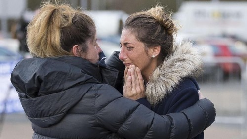 CARDIFF, WALES - JANUARY 25: Romina Sala (R), sister of Emiliano Sala, visits tributes at the Cardiff City Stadium on January 25, 2019 in Cardiff, Wales. Emiliano Sala is one of two people who boarded a Piper Malibu private plane on Monday night, taking the footballer from his previous club Nantes in France, to Cardiff City where he was due to begin training with his new team. Sala, originally from Argentina, had sent whatsapp messages to friends before the plane lost contact off Alderney in the Channel Islands. Rescuers have announced they are no longer actively searching for the plane. (Photo by Matthew Horwood/Getty Images)