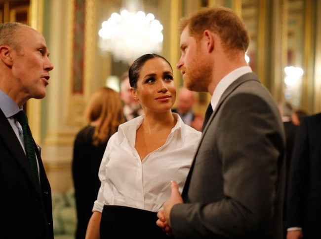 Meghan terlihat begita terpana memandang suaminya. Meghan dan Pangeran Harry menikah pada Mei tahun lalu. Janin yang dikandung Meghan saat ini adalah buah hati pertama mereka. (Foto: Getty Images)