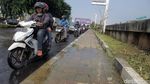 Ini Lho Penyebab Jalan KH Noer Ali Rusak Parah