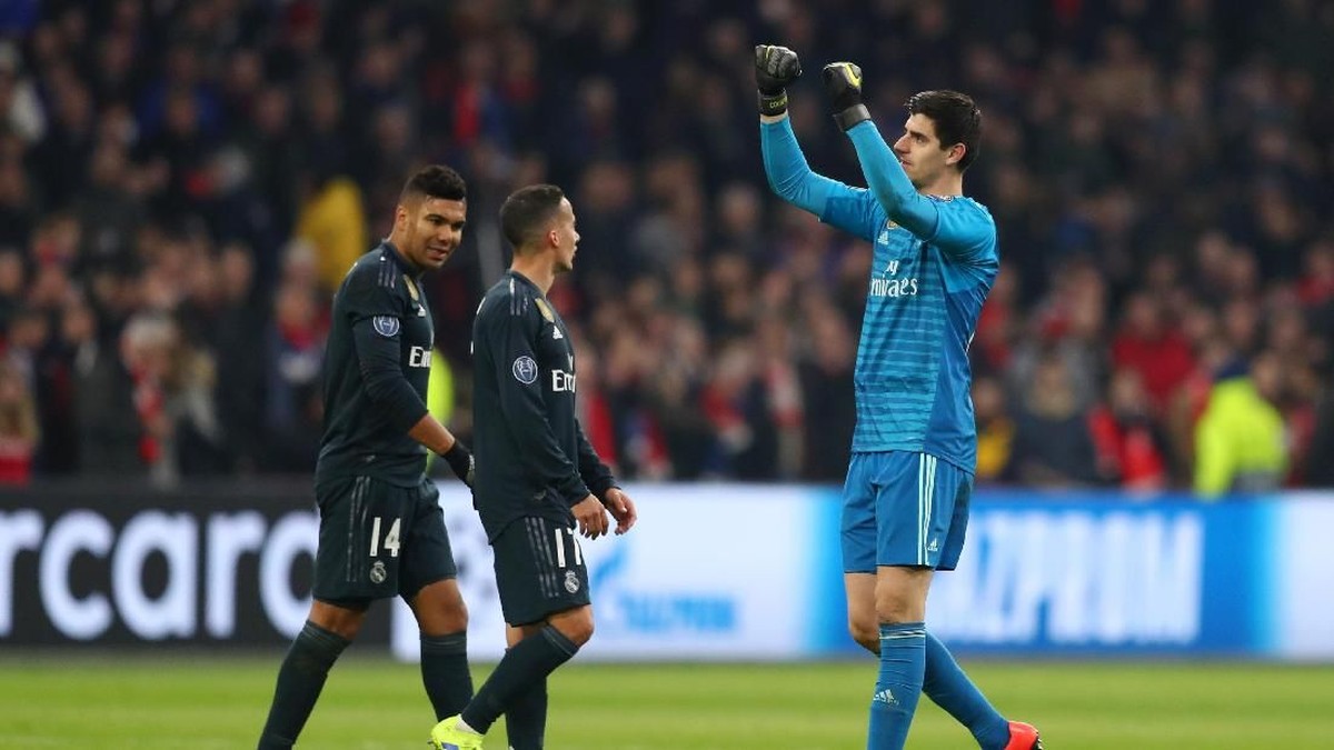 Pemain Real Madrid merayakan kemenangan 2-1 atas Ajax Amsterdam. (Foto: Lars Baron/Getty Images)