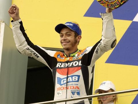 PHILLIP ISLAND - OCTOBER 20: Valentino Rossi of Italy and the Repsol Honda Team celebrates victory in the Skyy Vodka Australian Grand Prix which is Round 15 of the MotoGP series, held at the Phillip Island Circuit, Australia on October 20, 2002. (Photo by Robert Cianflone/Getty Images)