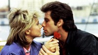 John juga pernah beradu akting dengan Olivia Newton-John dalam film komedi romantis bertajuk Two of a Kind di tahun 1983. Dok. Ist