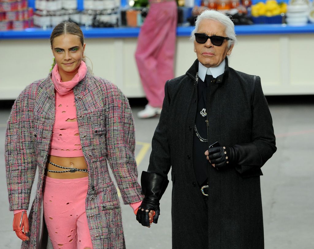 PARIS, FRANCE - MARCH 04:  Fashion Designer Karl Lagerfeld and model Cara Delevingne appear at the end of the runway during the Chanel show as part of the Paris Fashion Week Womenswear Fall/Winter 2014-2015 on March 4, 2014 in Paris, France.  (Photo by Francois Durand/Getty Images)