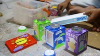 Kaleng disulap menjadi celengan, hiasan atau tempat cemilan.