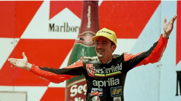 7 Apr 1996:  Max Biaggi shrugs his shoulders after finishing second in the 250cc Indonesian Motorcycle Grand Prix at Sentul, Jakarta.  Mandatory Credit: Mike Cooper/ALLSPORT