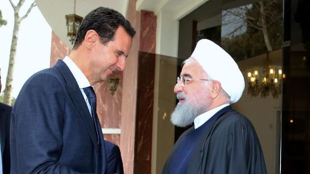 Iranian President Hassan Rouhani shakes hands with Syrian President Bashar al Assad, in Tehran, Iran, February 25, 2019. Official President website/Handout via REUTERS ATTENTION EDITORS - THIS IMAGE WAS PROVIDED BY A THIRD PARTY. NO RESALES. NO ARCHIVES