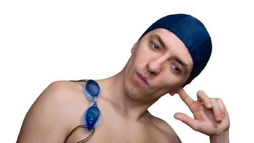 Water got into the ear of a swimmer who tries to shake it out.