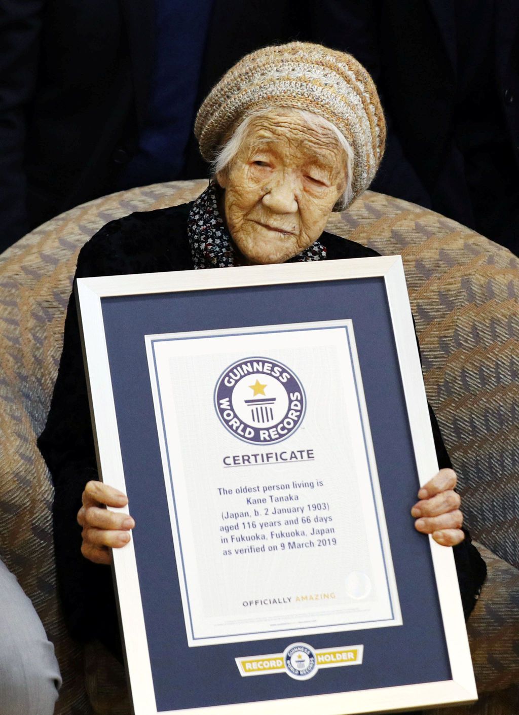 116-year-old Japanese woman Kane Tanaka holds a Guinness World Records certificate naming her as the world's oldest person living during a ceremony in Fukuoka, Japan March 9, 2019.  Mandatory credit Kyodo/via REUTERS ATTENTION EDITORS - THIS IMAGE WAS PROVIDED BY A THIRD PARTY. MANDATORY CREDIT. JAPAN OUT. NO COMMERCIAL OR EDITORIAL SALES IN JAPAN.