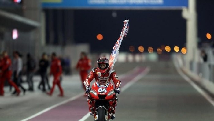 Mission Winnow Ducatis Italian rider Andrea Dovizioso celebrates winning the Qatar MotoGP grand prix at the Losail track in Qatars capital Doha on March 10, 2019. (Photo by KARIM JAAFAR / AFP)