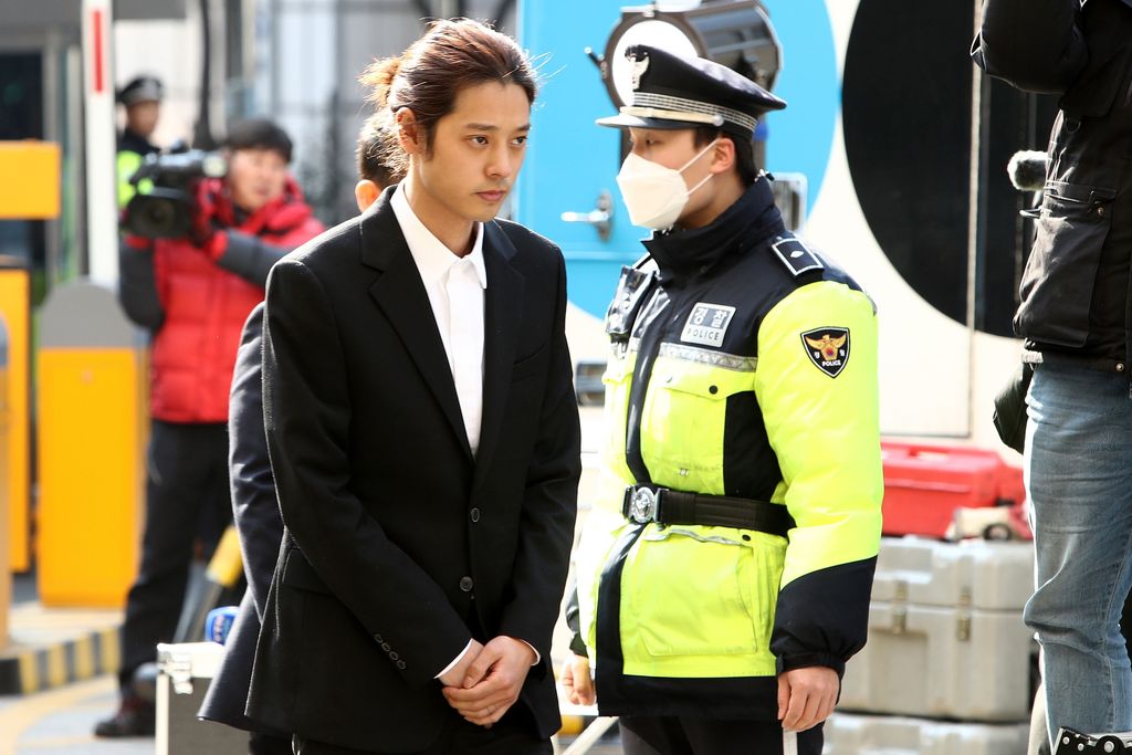 SEOUL, SOUTH KOREA - MARCH 14: Singer Jung Joon-young is seen arriving at a Seoul Metropolitan Police Agency on March 14, 2019 in Seoul, South Korea.  Jung Joon-young, a South Korean singer-songwriter and TV celebrity appeared at the police station on Thursday to be questioned over suspicions of sharing sexual videos in a group chat which included BIGBANG's member Seungri, who is facing charges of supplying prostitution services.  (Photo by Chung Sung-Jun/Getty Images)