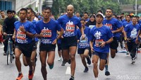 Water Run berlangsung di area Car Free Day kawasan Sudirman, Jakarta, Minggu (24/3/2019) pagi. 
