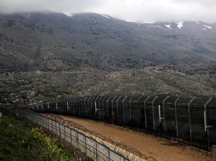 FILE PHOTO: Fences are seen on the ceasefire line between Israel and Syria in the Israeli-occupied Golan Heights March 25, 2019. REUTERS/Ammar Awad/File Photo
