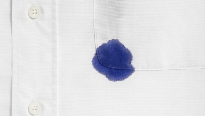 close up of businessman ruined shirt and and leaking pen
