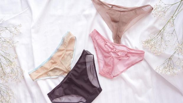 Fashion trendy lace lingerie. Different panties on white bed background. Beautiful sets to choose from. Colorful women's underwear, flatlay. Female wardrobe, shopping concept