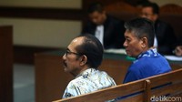Iswahyu dan Irwan didakwa menerima Rp 150 juta dan SGD 47 ribu atau totalnya sekitar Rp 620 juta dari Direktur CV Citra Lampia Mandiri (CLM) Martin P Silitonga. 