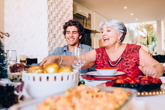 Brazilian grandmother and grandson at family lunch