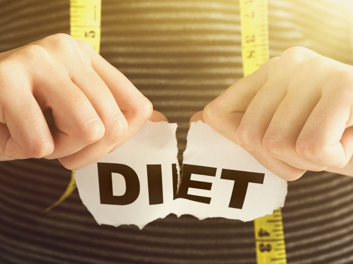 Young woman ends her diet. Has she succeeded or failed?