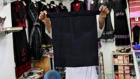 Meski tak menyebut secara spesifik kepada burka atau niqab, para perempuan Muslim tidak diperkenankan mengenakan aksesori yang menutupi wajah agar mudah diidentifikasi. Danish Siddiqui/Reuters.