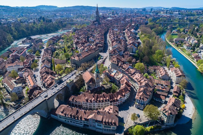 Aerial view of the Bern old town with the Aare river flowing around the town on a sunny day, Bern, Switzerland.