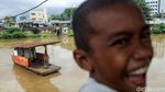 Potret Nahkoda Perahu Eretan dari Banjir Kanal Barat