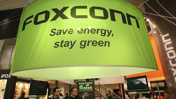 80103800 HANOVER, GERMANY - MARCH 04: The stand of Taiwanese electonics giant Foxconn promotes green and energy saving business practice at the CeBIT technology fair on the first day the fair opened to the public on March 4, 2008 in Hanover, Germany. CeBIT, the worlds largest technology trade fair, will run from March 4-9. (Photo by Sean Gallup/Getty Images)