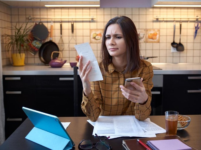Close up of female accountant or banker making calculations