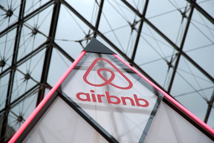 FILE PHOTO: The Airbnb logo is seen on a little mini pyramid under the glass Pyramid of the Louvre museum in Paris, France, March 12, 2019. REUTERS/Charles Platiau/File Photo