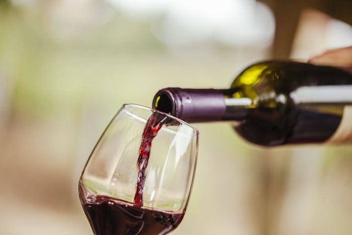 Red Wine Being Poured In The Glass